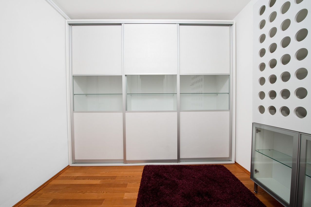 Room with modern white wardrobe
