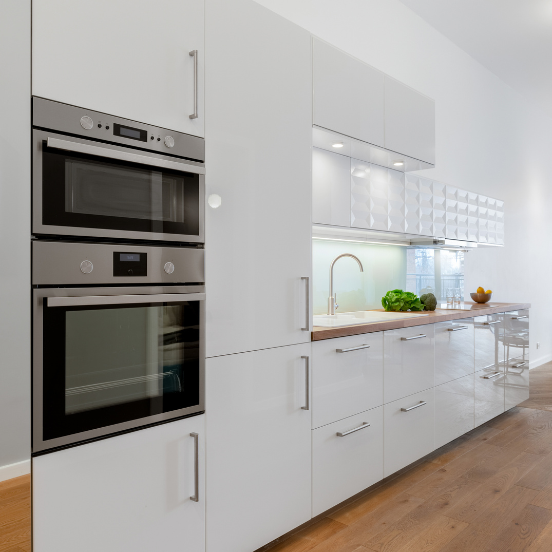 Small kitchen with white furniture
